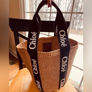 Chloé Woody Woven Tote Bag with Black Straps.